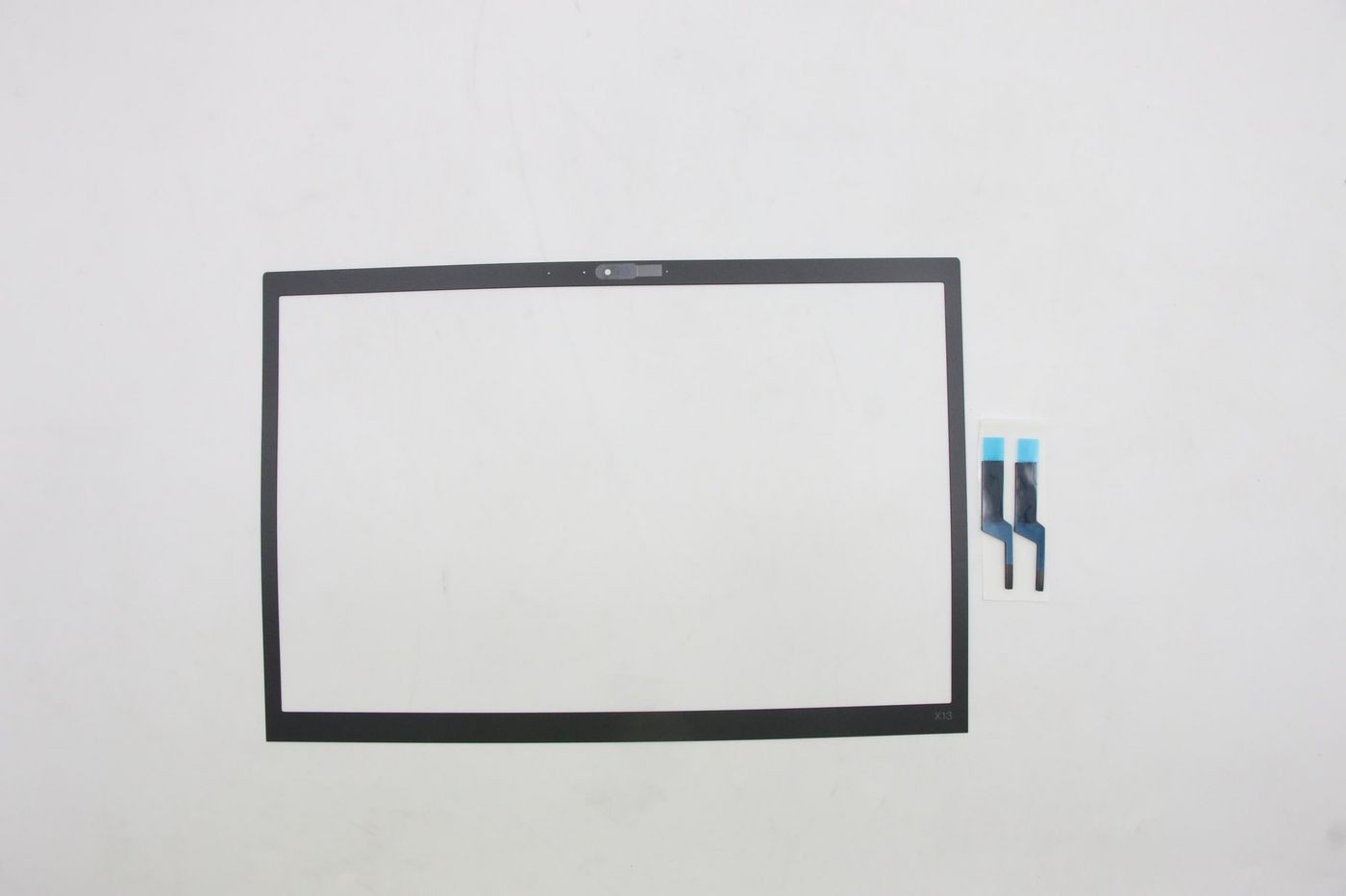 Black Lenovo IR Ezel screen bezel for FHD display, featuring a cutout for a webcam at the top and accompanied by adhesive strips for installation.