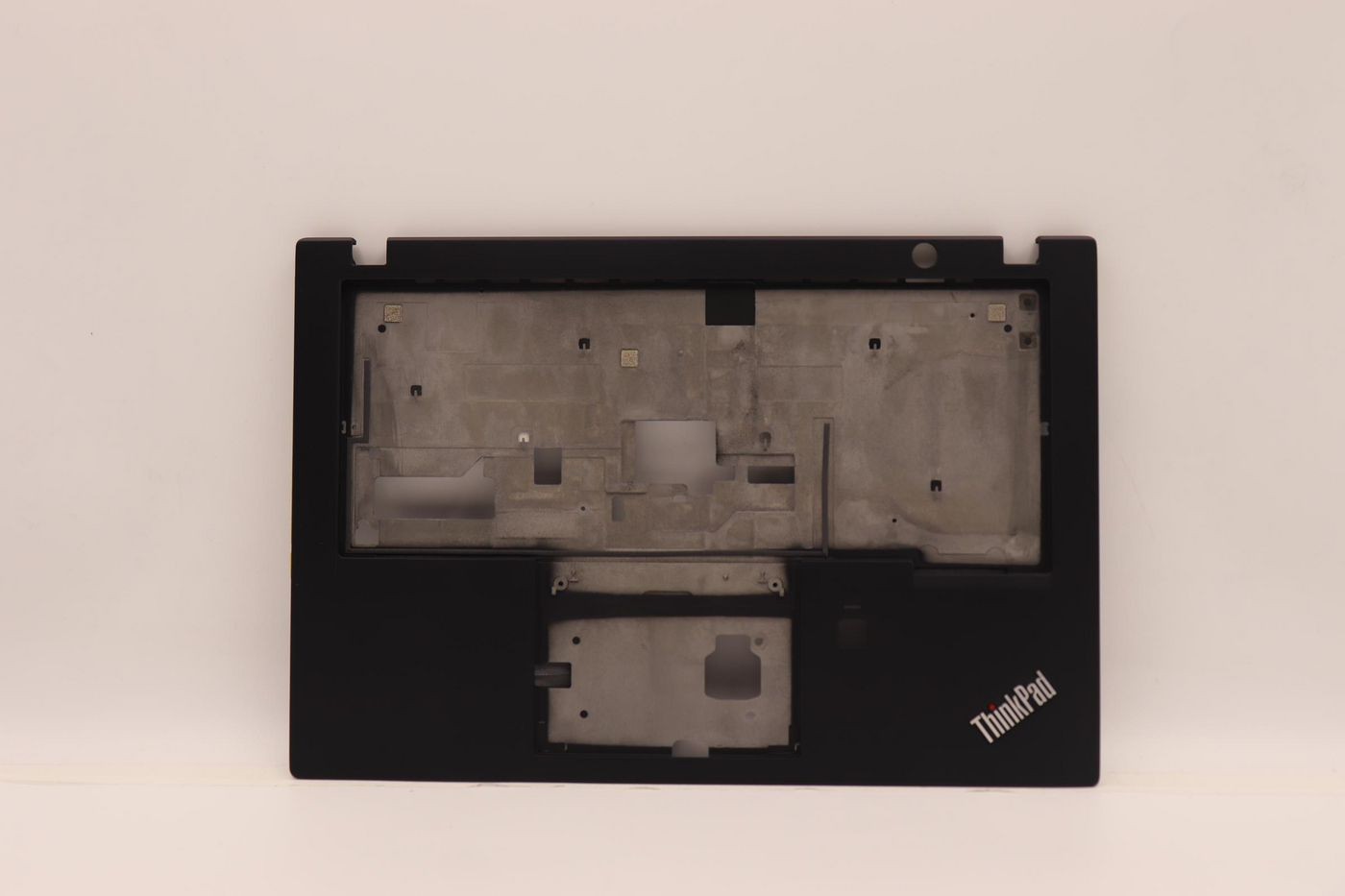 Black Lenovo keyboard base with a smooth surface, featuring cutouts for keys and a fingerprint reader, marked with "ThinkPad" logo in the bottom right corner.
