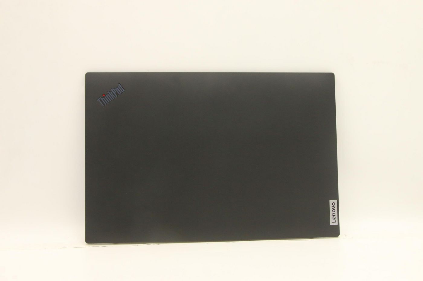 Black Lenovo ThinkPad plastic cover assembly featuring a smooth finish and the Lenovo logo in the bottom right corner.