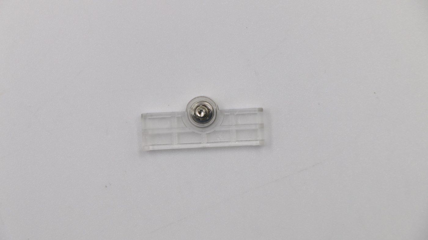 Clear plastic mounting bracket with a central metallic screw, designed for securing WiFi components, featuring a rectangular shape with a grid pattern.