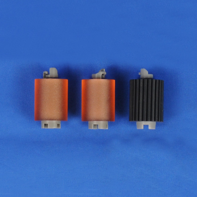 Three printer separation rollers in orange and black colors, featuring smooth and ribbed surfaces, designed for Lexmark printers, displayed on a blue background.