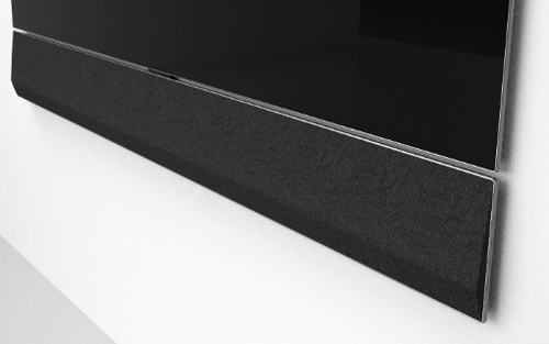 LG GX 3.1 Channel Soundbar features a sleek, black fabric finish, designed to mount flush against the wall, with a modern aesthetic complementing any home entertainment setup.