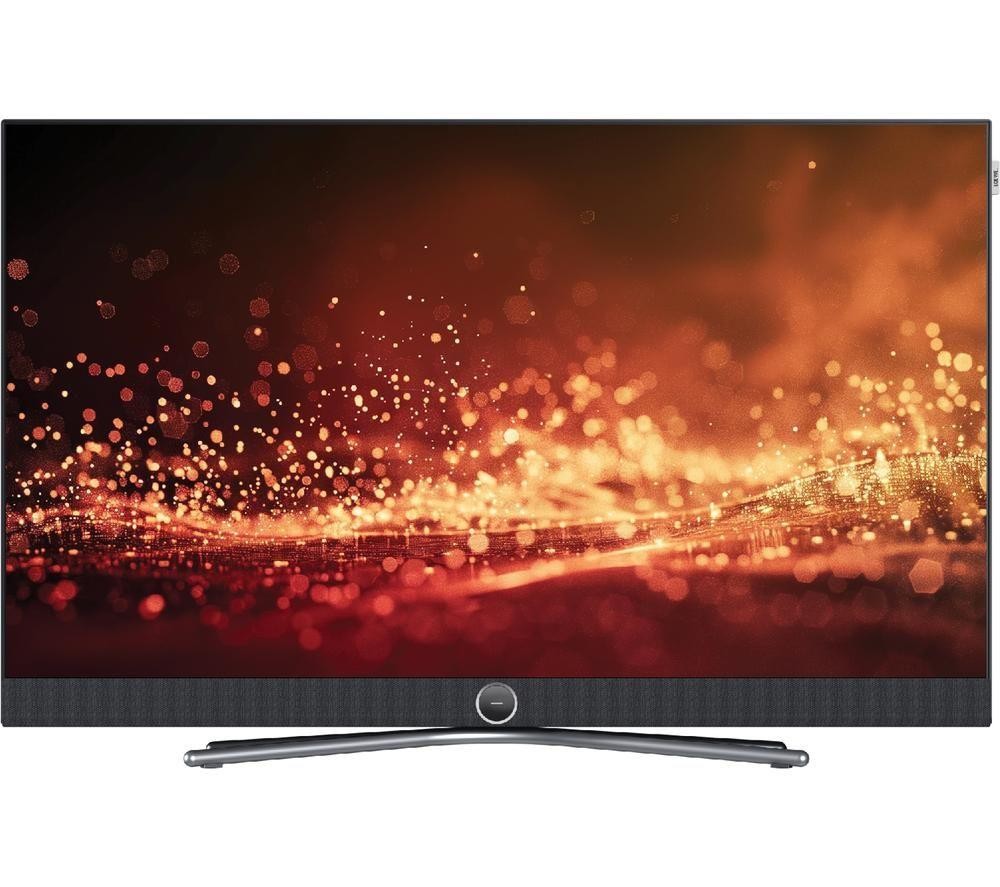 Loewe Callas 43-inch 4K LED TV featuring a sleek black frame, a modern stand, and a vibrant display with warm orange and gold bokeh effects.