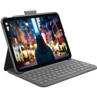 Gray Logitech Bluetooth keyboard with QWERTY Nordic layout, attached to a tablet in a protective case.