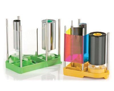 MAGICARD Prima 831 YMCK ribbon and retransfer film set featuring vibrant colored spools in green and yellow holders, designed for 1,000 prints with a sleek, professional finish.