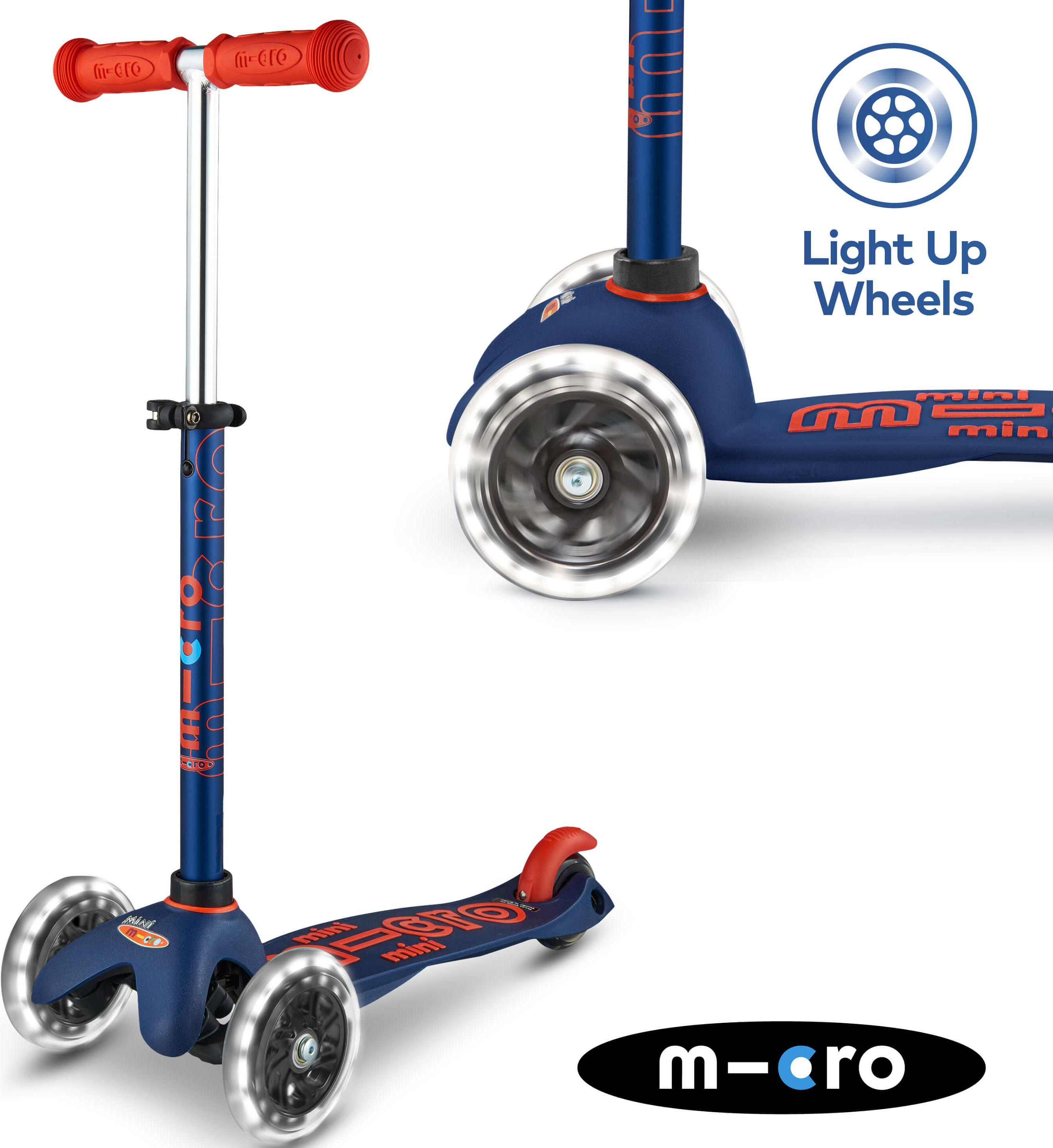 Navy Micro Mini Deluxe LED scooter with red handles, light-up wheels, and adjustable T-bar.