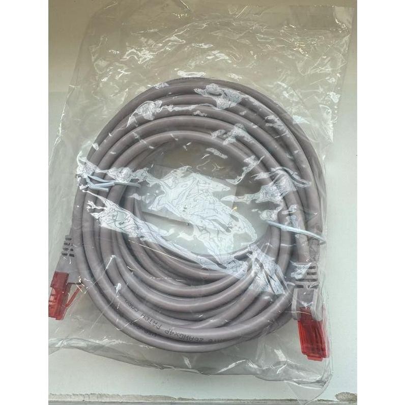 Purple 3-meter Microconnect Cat6 U/UTP networking cable, coiled and packaged, featuring transparent plastic wrapping and red connectors on both ends.