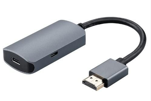 Gray Microconnect HDMI/USB 3.2 laptop dock with a compact design, featuring a USB-C port and a standard HDMI connector, connected by a flexible cable.