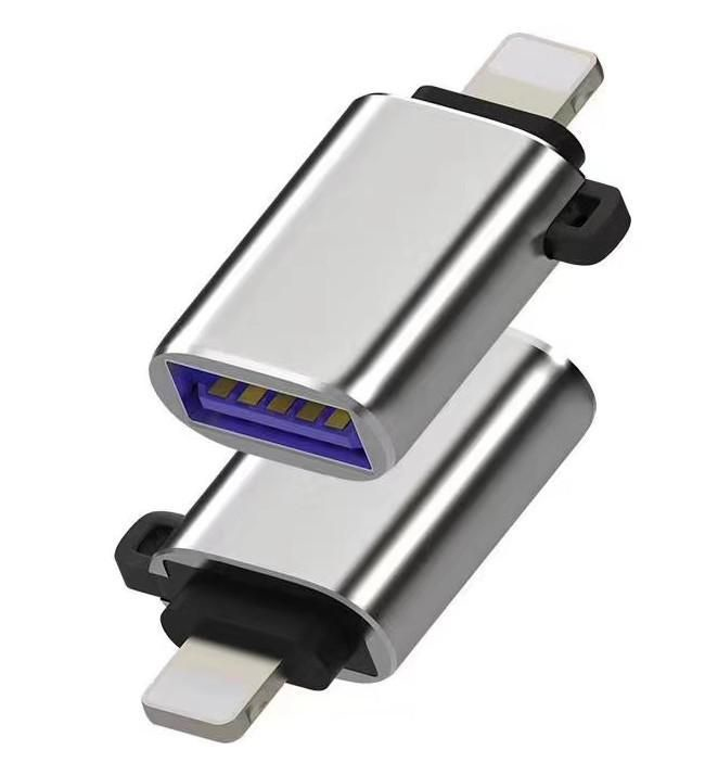 Silver Microconnect MC-LIGHTUSB3 cable gender changer featuring a Lightning connector and USB-A port, with a sleek metallic finish and black rubber grips on both ends.
