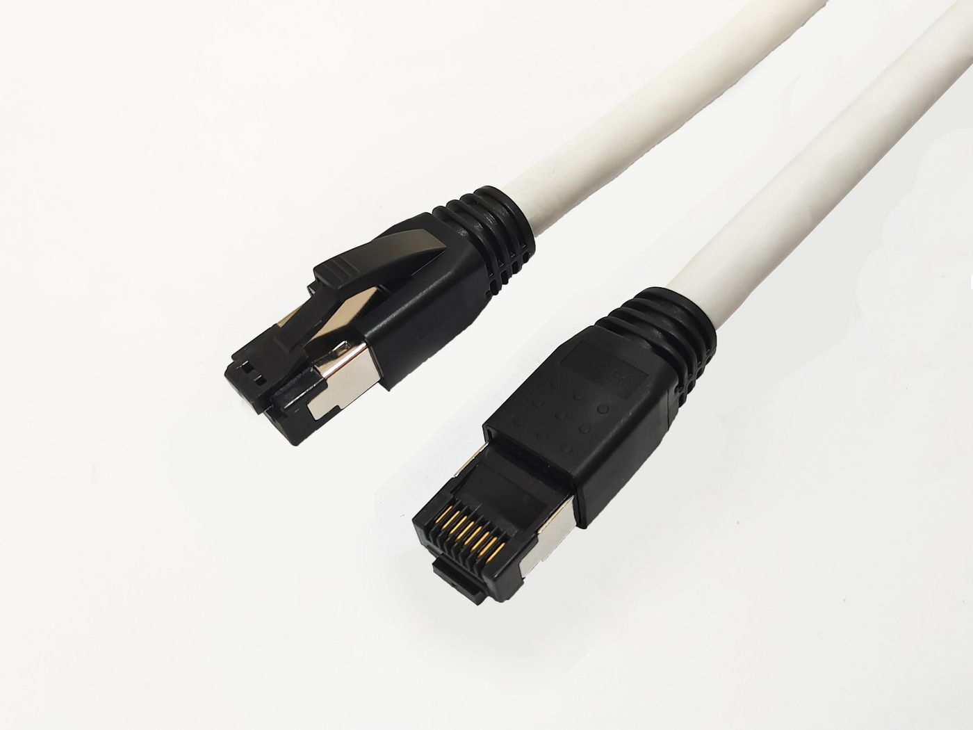 White 1.5m Cat8.1 S/FTP networking cable with black connectors, featuring a sturdy design for high-speed data transmission.