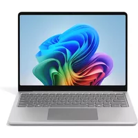 Platinum Microsoft Surface Laptop 13" with touchscreen, sleek design, and vibrant display.