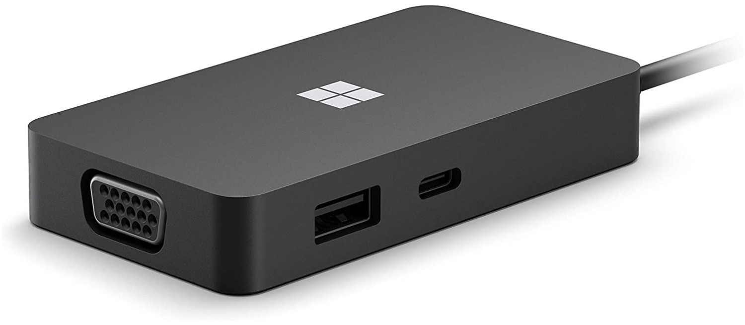 Black Microsoft USB-C Travel Hub featuring a sleek design, USB and USB-C ports, VGA output, and a prominent Microsoft logo on the top surface.
