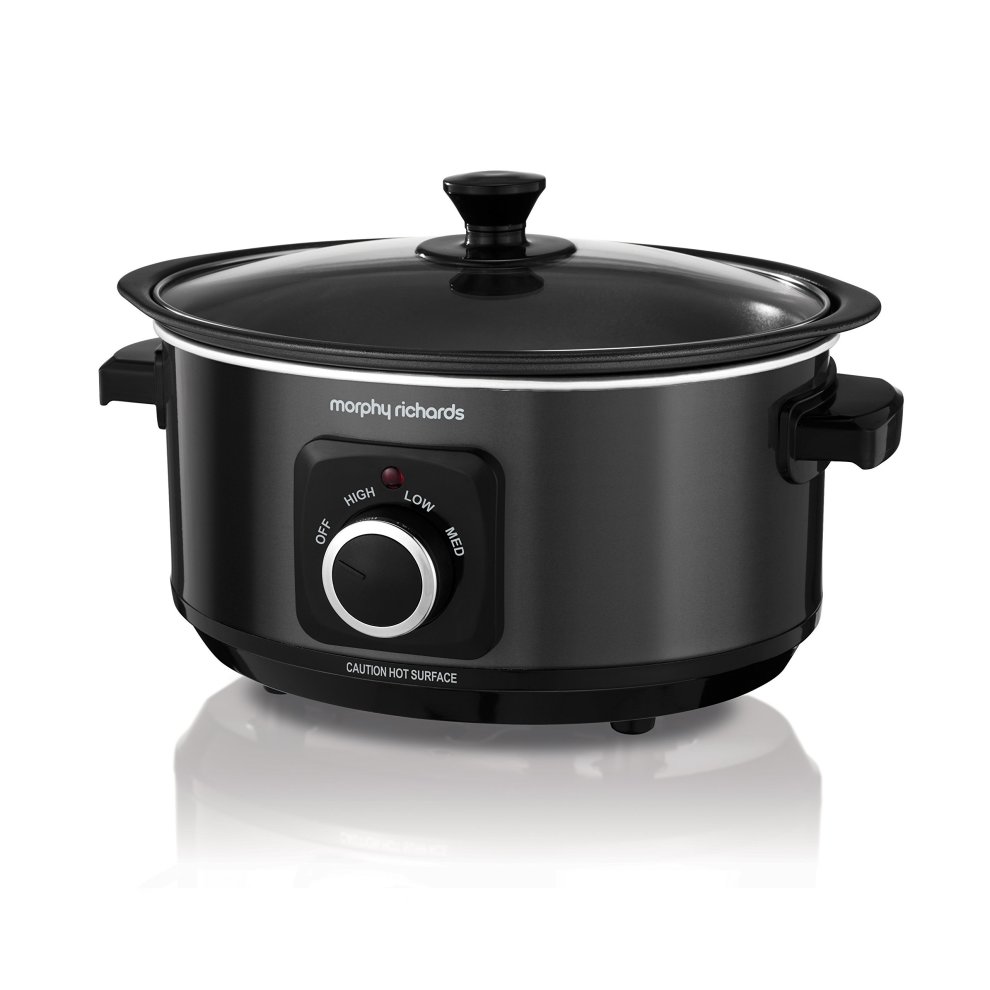 Black 3.5L slow cooker with a glass lid, featuring a silver control dial for temperature settings (off, low, medium, high) and a caution label for hot surfaces.