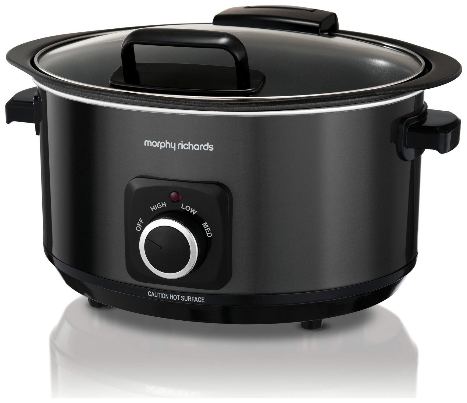 Black 6.5L slow cooker with a hinged lid, featuring a control dial for OFF, LOW, MED, and HIGH settings, and a caution label indicating a hot surface.