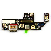 Black Motorola charge port board with USB-C connector and multiple circuit components on a compact rectangular layout.