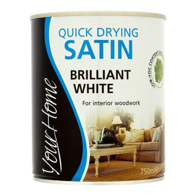 Quick Dry Satin Paint in Brilliant White, 750ml can, features a sleek design with a black and blue label, ideal for interior woodwork, emphasizing low VOC content.