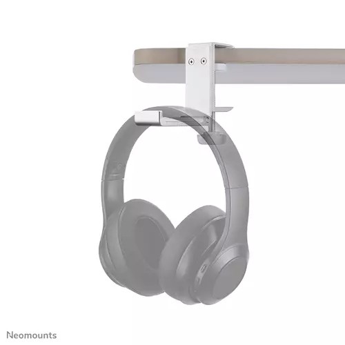Silver metal headset holder with a sleek design, mounted under a desk, supporting a pair of gray over-ear headphones.