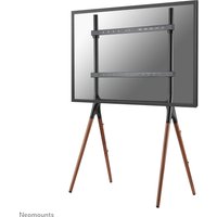 Black Neomounts TV floor stand with wooden tripod legs, supporting a flat-screen TV, suitable for 37-70 inch displays.
