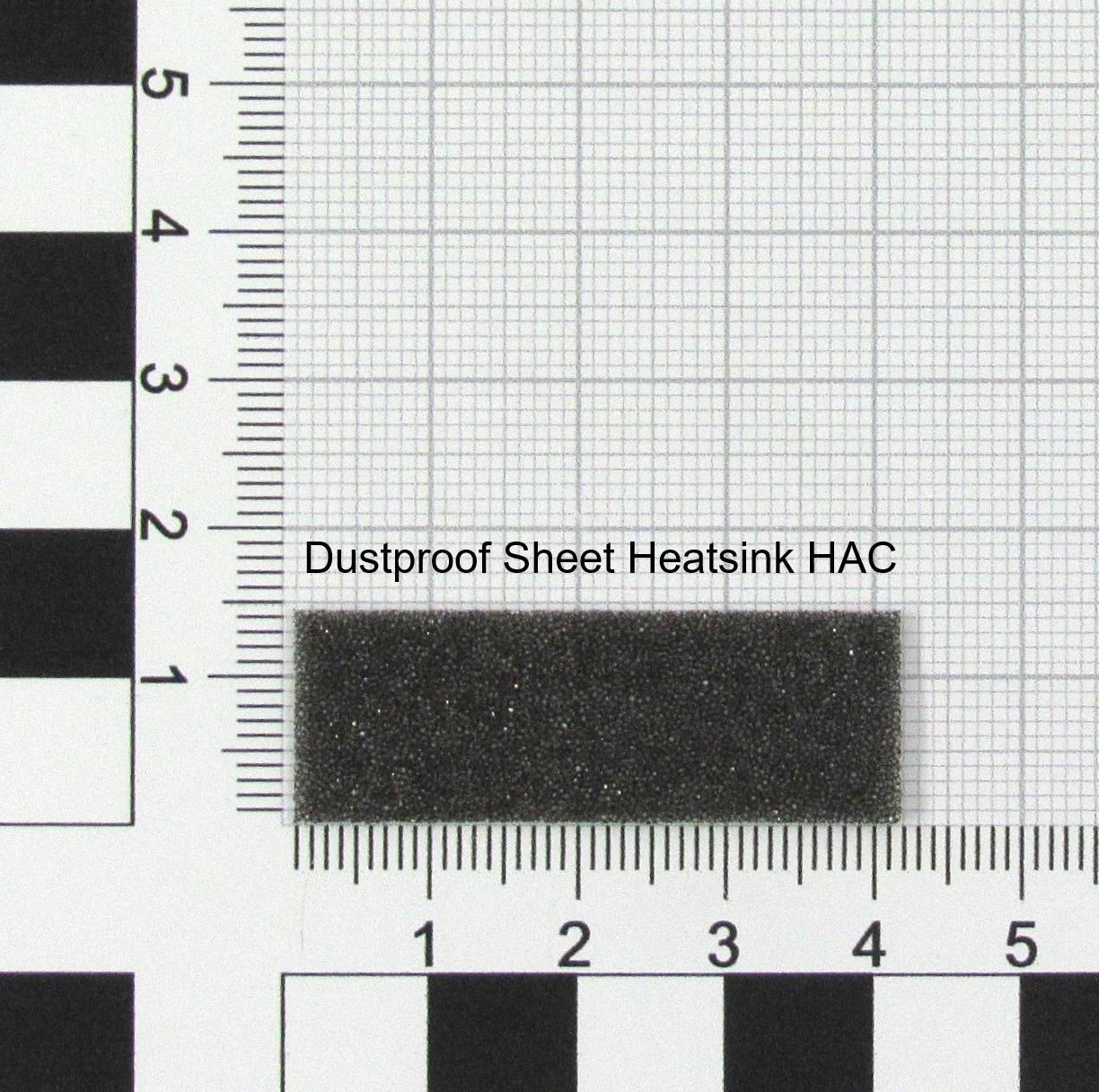 Black dustproof sheet heatsink with a textured surface, measuring approximately 2 cm by 5 cm, placed against a grid background with measurement markings.