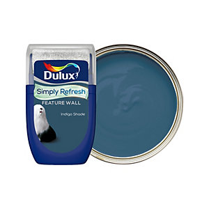 Dulux Simply Refresh Feature Wall tester in indigo shade, 30ml, featuring a sleek blue container with a silver lid and a circular paint sample showing a rich, deep blue color.