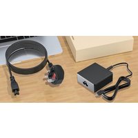 Black Origin Storage 100W USB-C adapter with UK plug, coiled black cable, and compact rectangular design.