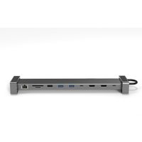Slim gray Origin Storage USB-C travel dock with dual HDMI, multiple ports, and EU AC adapter, supports 4K and 100w power.