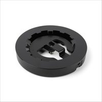 Black circular stand with grooved edges for Owl Labs Meeting Owl 4+, sleek and minimalist design.