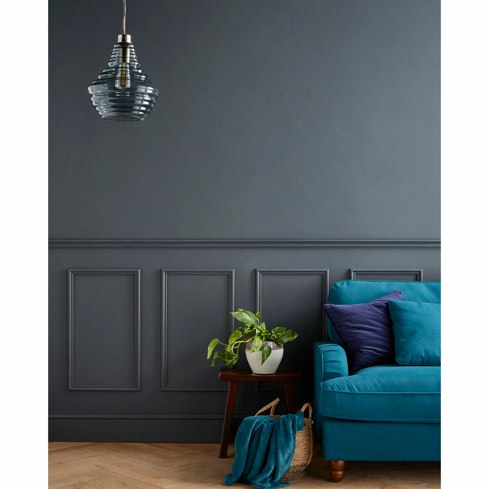 PaintReady Mix & Match Wall Panel Kit in a sleek dark grey finish, featuring three panels and a dado rail, set against a stylish living room backdrop with a teal sofa and decorative elements.