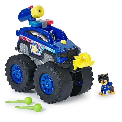 Blue and red monster truck with oversized black wheels, featuring a yellow front scoop and a police siren, accompanied by a small Chase figurine in a blue uniform.