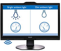 Philips B Line 242B1/00 monitor features a sleek black design, 23.8-inch Full HD display, and visual indicators for ambient light adjustment on the screen.