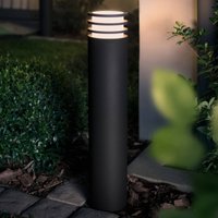 Black Philips Hue Lucca LED path light with cylindrical design and horizontal slats on top.