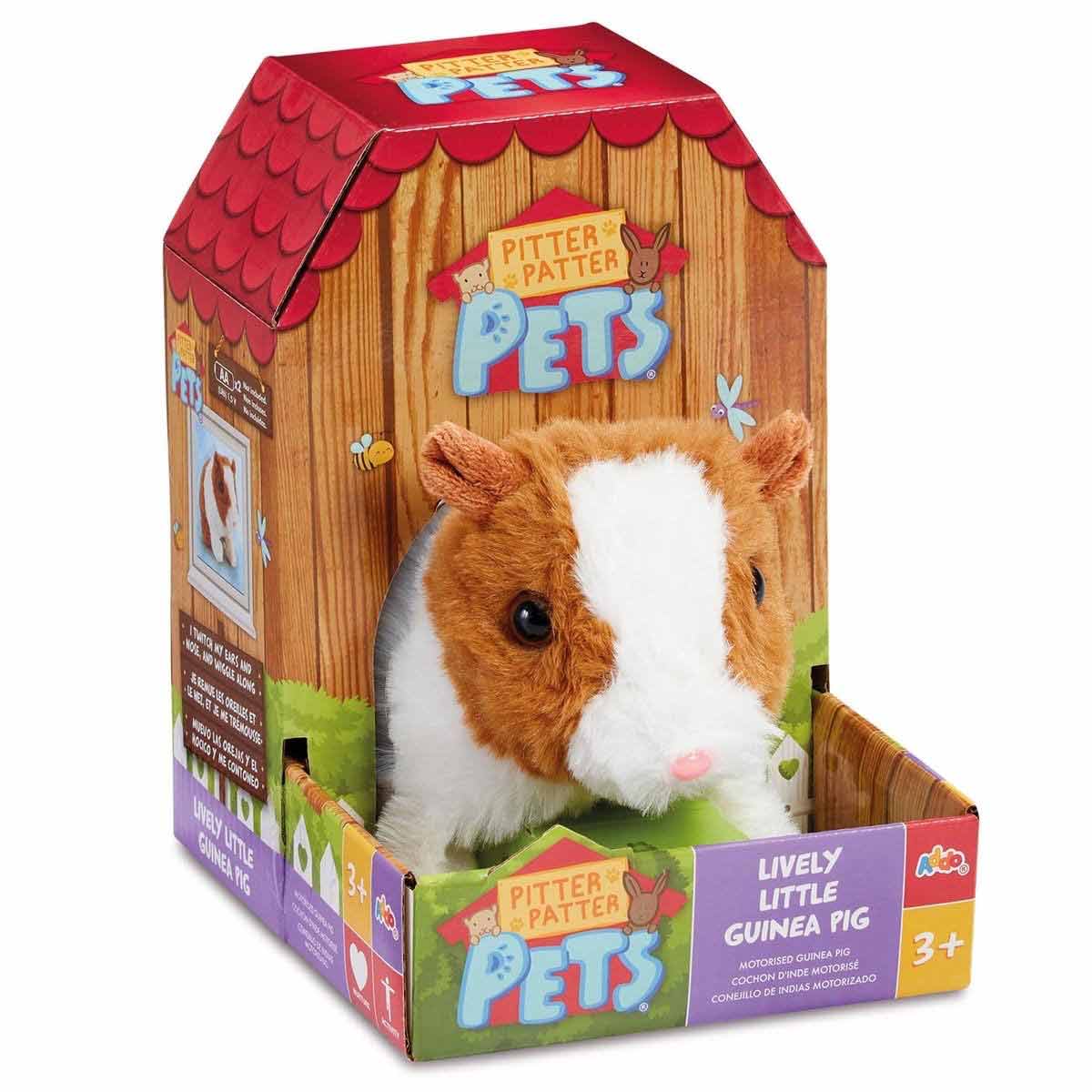 Soft, plush guinea pig toy with a brown and white fur pattern, featuring a friendly face and packaged in a colorful box with a farm-themed design, suitable for ages 3 and up.