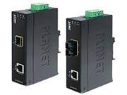 Black metal network media converter with two Ethernet ports, green terminal block, and LED indicators, labeled "PLANET" on the side, designed for 200 Mbit/s data transmission.