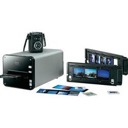 Plustek Opticfilm 120 Scanner in sleek black with a silver front, featuring a film holder, buttons on the side, and several film strips and photos displayed nearby.