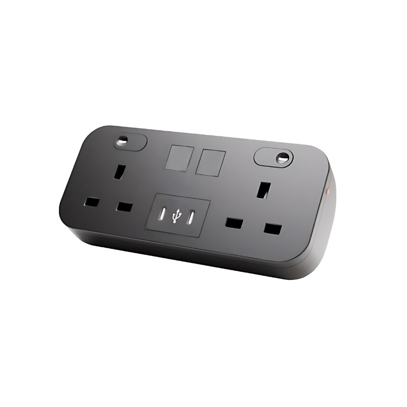 Black desktop power strip with two UK power sockets, dual USB-C ports, and a sleek, rounded design, featuring a textured surface and a compact form factor.