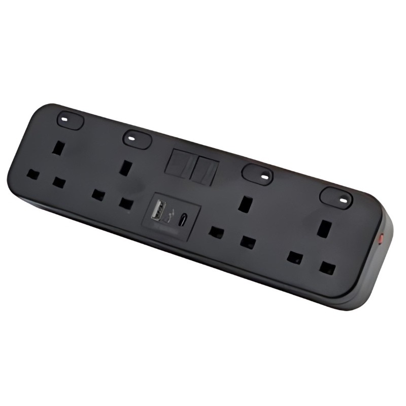 Black desktop power strip featuring four AC outlets, two USB-A ports, and a USB-C port, made of durable plastic with a sleek design and mounting holes for easy installation.