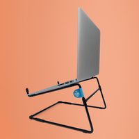 Black metal R-Go Tools laptop stand with angled support, suitable for 10-22 inch laptops, on a peach background.