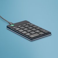 Black R-Go Tools ergonomic numeric keypad with USB cable, featuring green LED indicator on a blue background.