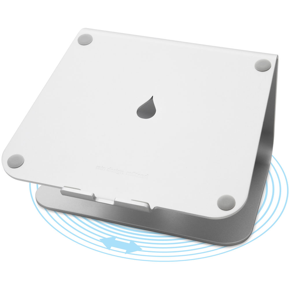 Silver laptop stand with a sleek, minimalist design, featuring a circular cutout at the center and rubber feet for stability, allowing for 360-degree rotation.