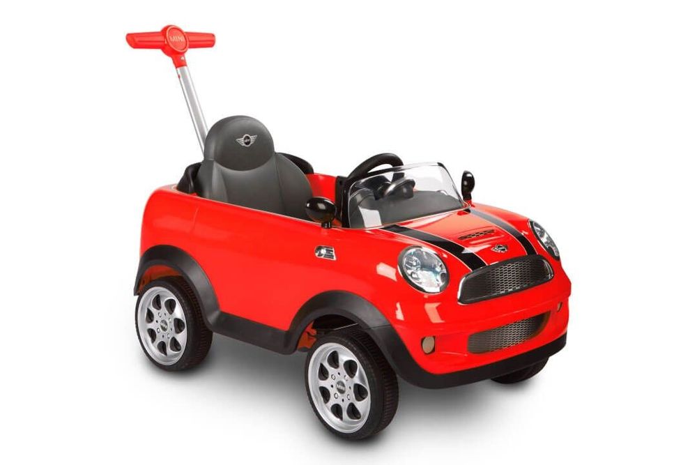 Red Rollplay Mini Cooper push-along ride-on car featuring a sleek design, black accents, a steering wheel, and chrome-like wheels, ideal for young children.