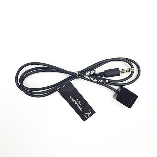 Black audio cable with a 3.5mm jack and a rectangular connector, featuring a caution label and "Samsung" branding on the wire.