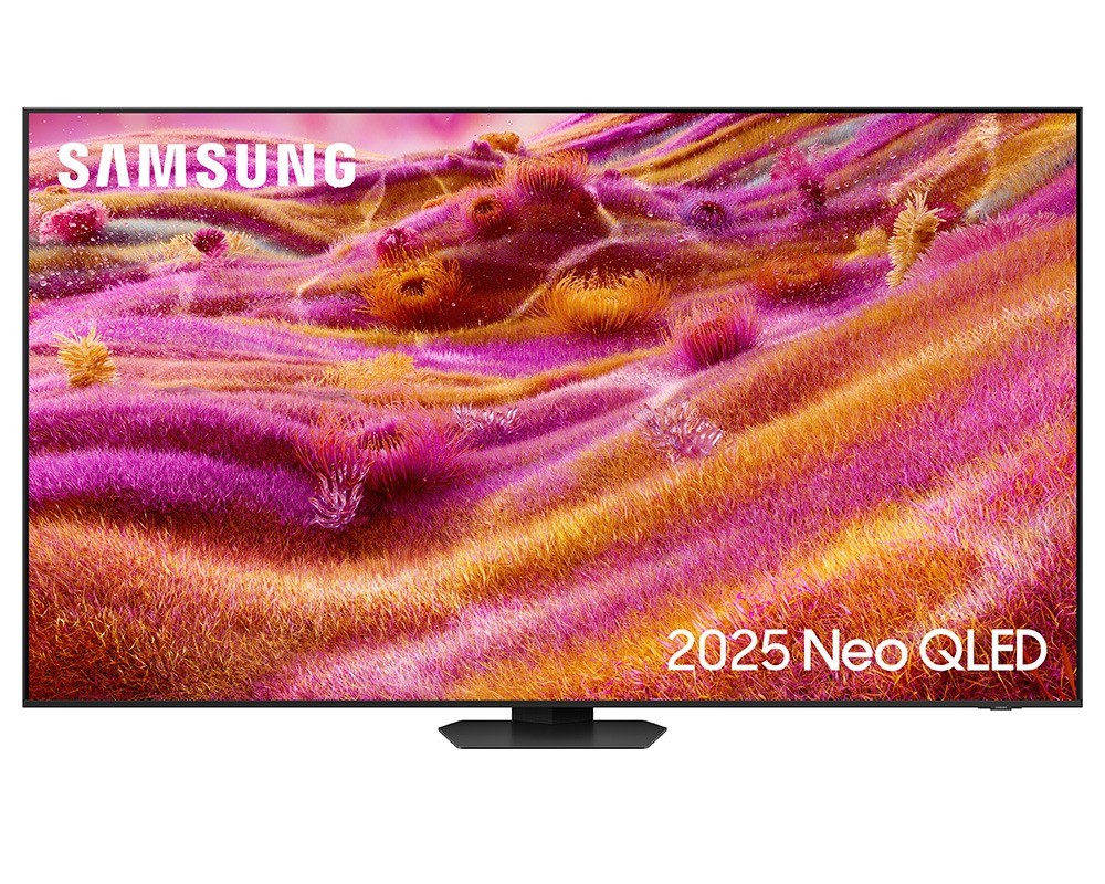 Samsung QE98QN93F 98" NEO QLED 4K Smart TV featuring a vibrant pink and purple landscape display, sleek black frame, and a modern stand, showcasing Dolby Atmos and 165Hz refresh rate.