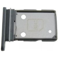 Gray Samsung SIM card tray with three circular holes and a rectangular cutout.