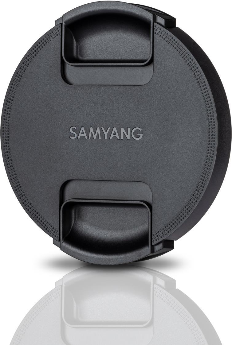Black circular lens cap with textured edges and two side grips, featuring the embossed brand name "SAMYANG" prominently on the surface.
