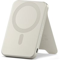 Sand-colored Satechi 5000 mAh power bank with wireless charging, sleek rectangular design, and foldable stand.