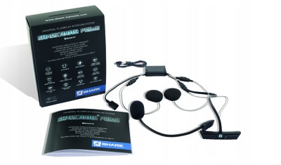 Black and silver Shark Sharktooth 4 Prime Bluetooth intercom system with dual speakers, a microphone, and a user manual, all packaged in a sleek black box featuring white text and icons.