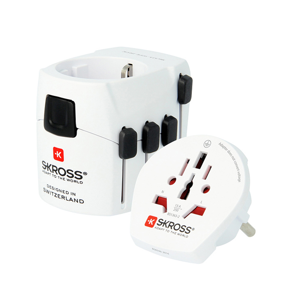 White Skross Pro Travel Adapter with multiple plug options, featuring a compact design, black accents, and labeled input/output sections for worldwide connectivity.