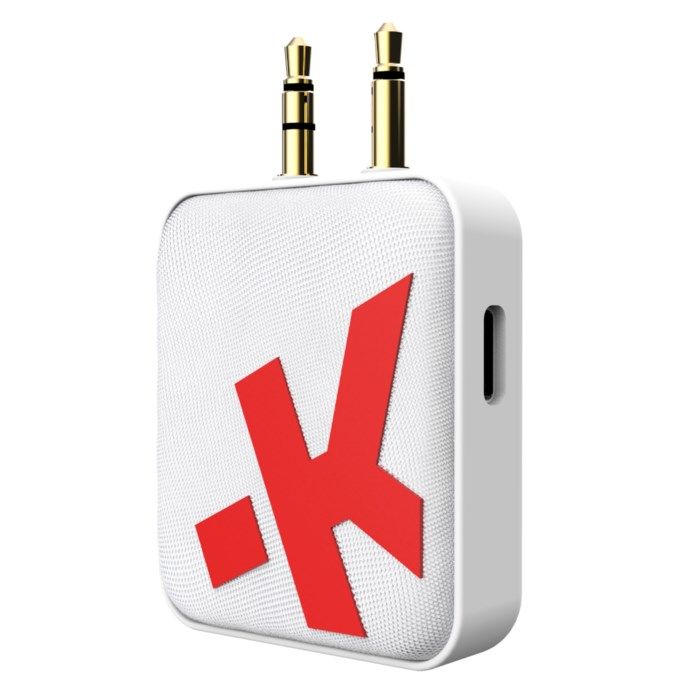 Wireless audio adapter in white with a textured surface, featuring two gold audio jacks and a prominent red Skross logo, compact design for Bluetooth connectivity.