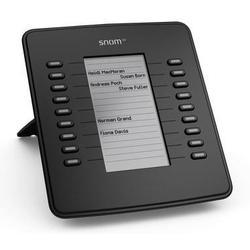 Black Snom D7 IP add-on module featuring 18 programmable buttons, a sleek design, and a central display for enhanced functionality.