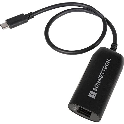 Black USB-C 2.5Gb Ethernet adapter with a short cable, featuring the Sonnet logo prominently on the side and an Ethernet port on the opposite end.